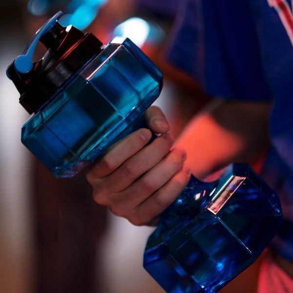 Close up of a hand gripping a dumbbell
