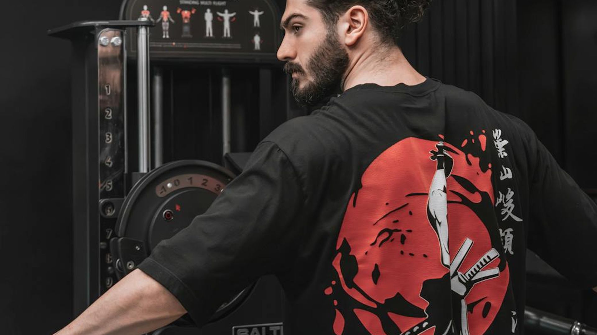 Strong man focusing on his workout routine in gym